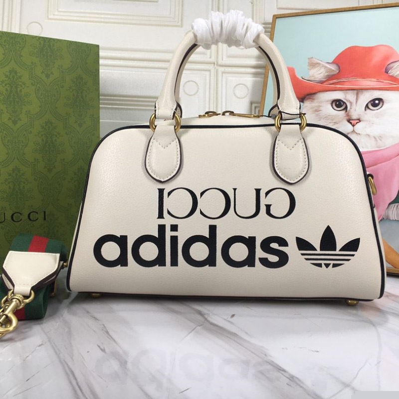 G*u*i top handle bags